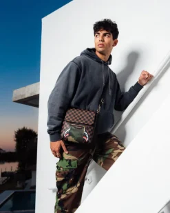 EXTERIOR GOLD ZIP POCKET SHARKS IN PARIS MESSENGER SLING BAG